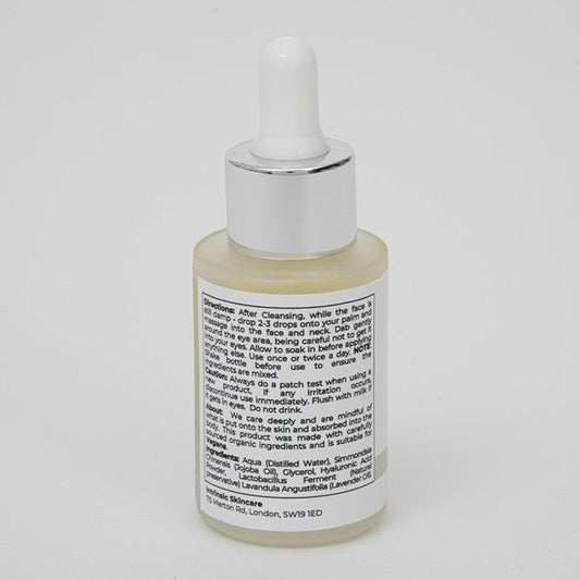 Intrinsic Skincare UK 2% Hyaluronic Acid Serum in a clear glass dropper bottle with white cap on a white background.